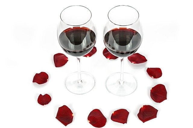 Two glasses with red roses